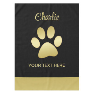Gold Shiny Dog Paw on black background Tablecloth
