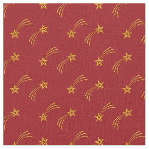 Gold shooting star on red fabric
