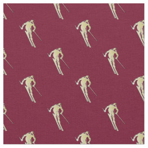 Gold skier on red fabric