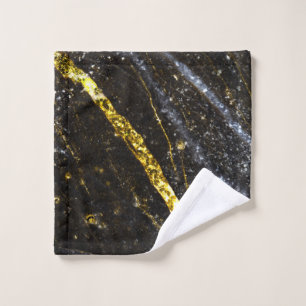 Gold sparkly line on black rock abstract wash cloth