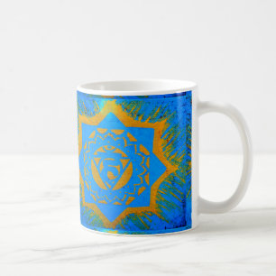 gold tantric symbol on blue coffee mug