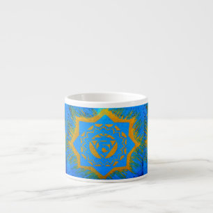 gold tantric symbol on blue espresso cup