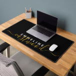 Gold White Script Monogram On Black Desk Mat<br><div class="desc">An elegant modern trendy style monogrammed desk mat with a sans serif first name and an elegant gold script last name. For home or office.</div>