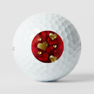 Golden and red valentines golf balls