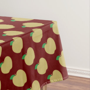Golden Apple on Red Tablecloth