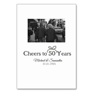 Golden bow cheers to 50 years anniversary wedding table number