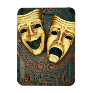 Golden comedy and tragedy masks on patterned magnet