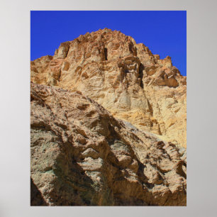 Golden Desert Cliff Under Blue Sky Poster