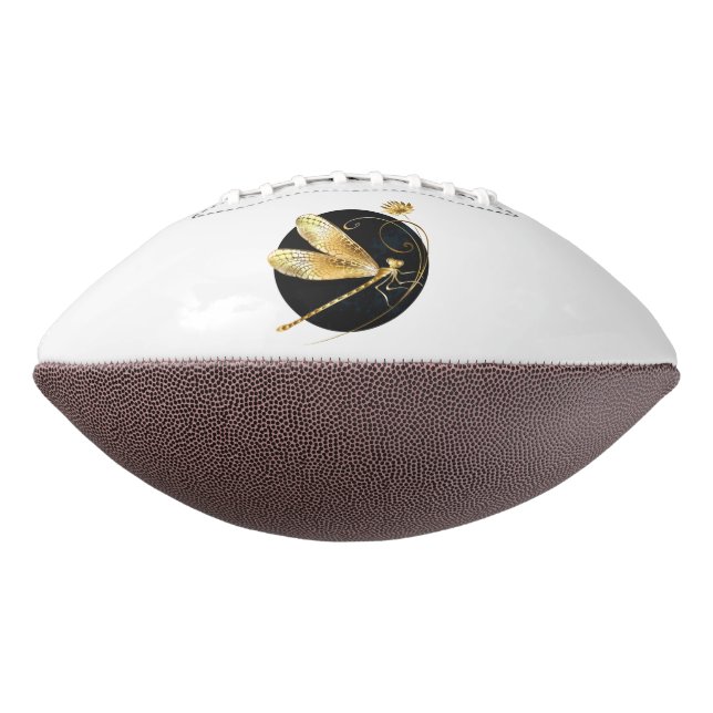 Golden dragonfly in black circle football (Rotated 270)
