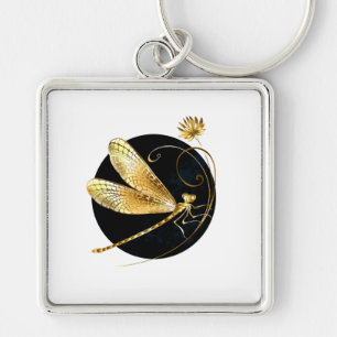Golden dragonfly in black circle keychain