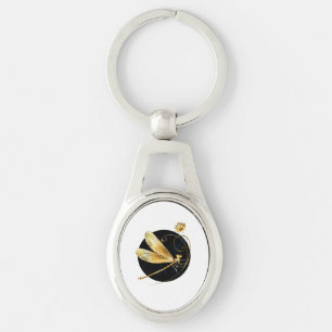 Golden dragonfly in black circle keychain