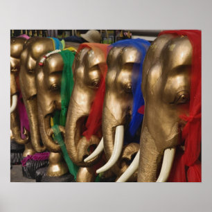 Golden elephants decorated with colourful poster