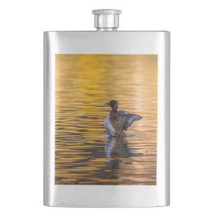 Golden eye on a golden lake hip flask