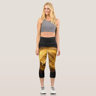 Golden Fire Works on Dark Background Capri Leggings