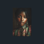 Golden Glow Melanin Regal Headscarf Portrait Canvas Print<br><div class="desc">Golden light caresses rich brown skin, illuminating sharp cheekbones, glossy lips, and intense dark eyes beneath a luxurious emerald-magenta-gold paisley headscarf. Elaborate antique gold earrings with dangling gems frame her face, while the high-neck embroidered garment in jewel tones adds regal texture and depth. The intimate close-up against a moody dark...</div>