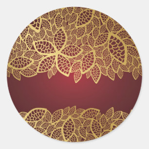 Golden leaf lace on red background classic round sticker