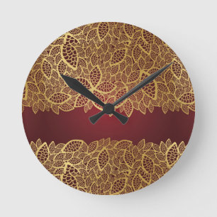 Golden leaf lace on red background round clock