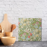 Golden Lily Wildflowers William Morris Tile<br><div class="desc">A decorative ceramic tile with the floral pattern originally designed by the British Artist William Morris from the Arts and Crafts Period. Gold edged lilies with red and blue wildflowers.</div>