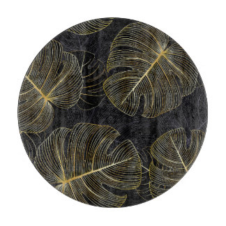 Golden monstera leaves, romantic seamless floral. cutting board