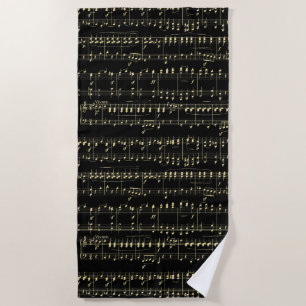 Golden Music on Black Beach Towel