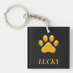 Golden Paw Print Against Black Background Keychain