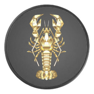 Golden polygonal lobster crawfish on black hockey puck