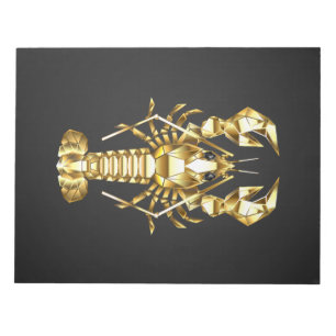 Golden polygonal lobster crawfish on black notepad