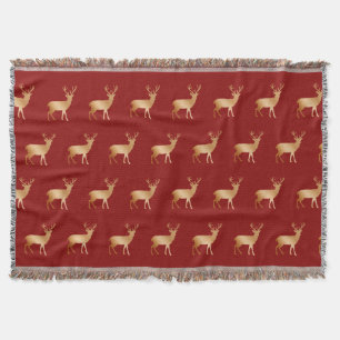 Golden reindeer pattern on red throw blanket