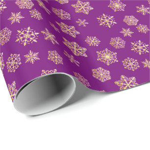 Golden snowflakes on a purple background wrapping paper
