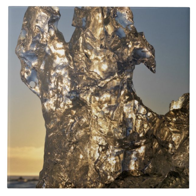Golden sunrise seen through iceberg formation tile (Front)