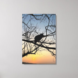 Golden Sunset Silhouette: Bird on Tree Branches Canvas Print