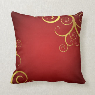 Golden swirls on deep red throw pillow