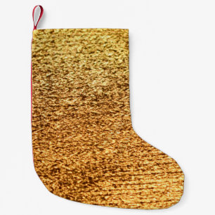 Golden textile: glamourous macro background. small christmas stocking