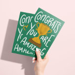 Golden Trophy Congratulations Greeting Card<br><div class="desc">When you want to give someone a trophy for being so gosh darn amazing but you have to settle for a paper card, this is it. A hand-lettered message that says "congrats, you are amazing" around a golden trophy illustration on a green background with easy to customize text inside to...</div>