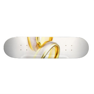 Golden Wedding Rings On White Background Skateboard