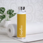 Golden Yellow Personalized Wedding Bridesmaid Water Bottle<br><div class="desc">Gift your wedding bridesmaid or maid of honour with this trendy, vacuum Insulated water bottle that features her name in white stylized script on a golden yellow colour background designed to match your wedding colour scheme. Personalize bottle by editing and replacing name with your own as desired. Select your water...</div>