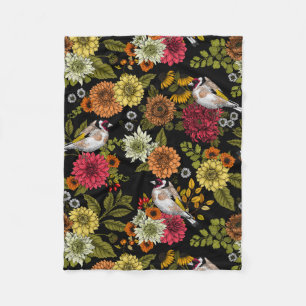 Goldfinches in the garden on black fleece blanket