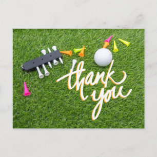 Golf ball and colourful tee  green grass thank you postcard