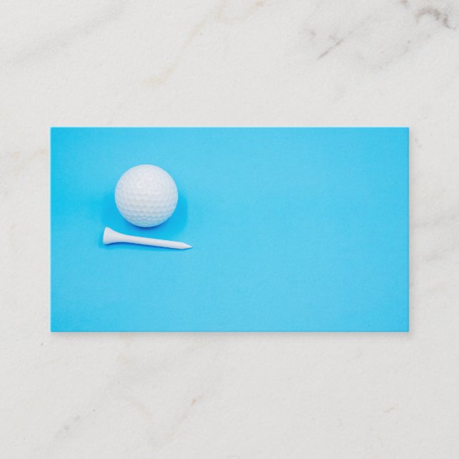 Golf ball and tee on blue background business card (Front)
