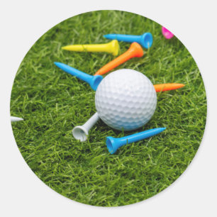 Golf ball and tee on green grass classic round sticker