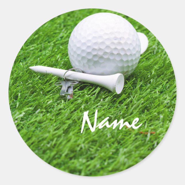 Golf ball and tee on green grass classic round sticker (Front)