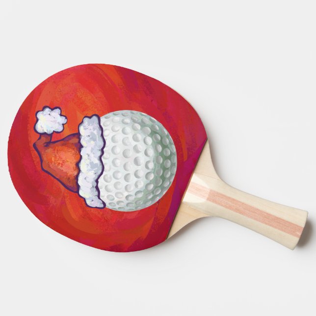Golf Ball in Santa Hat on Red Ping Pong Paddle (Side)