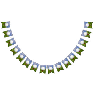 golf ball on red tee in grass bunting flags