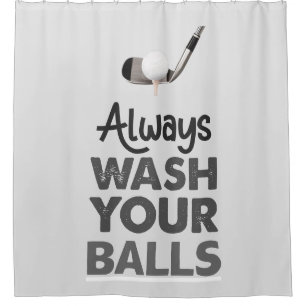 Golf ball on tee with iron always wash your balls 