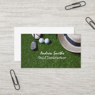 Golf ball shoe putter on green golfer business car business card