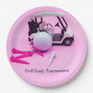 Golf ball with golf cart and pink tee on pink paper plate