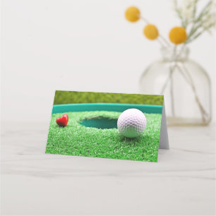 Golf ball with heart next to the hole place card