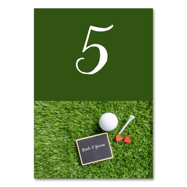 Golf ball with name on chalkboard are on green table number (Front)