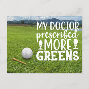 Golf  ball with tee on green grass   postcard