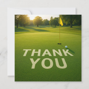 Golf ball with word thank you on putting green